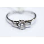 A platinum and solitaire diamond ring, diamond weight approx 0.