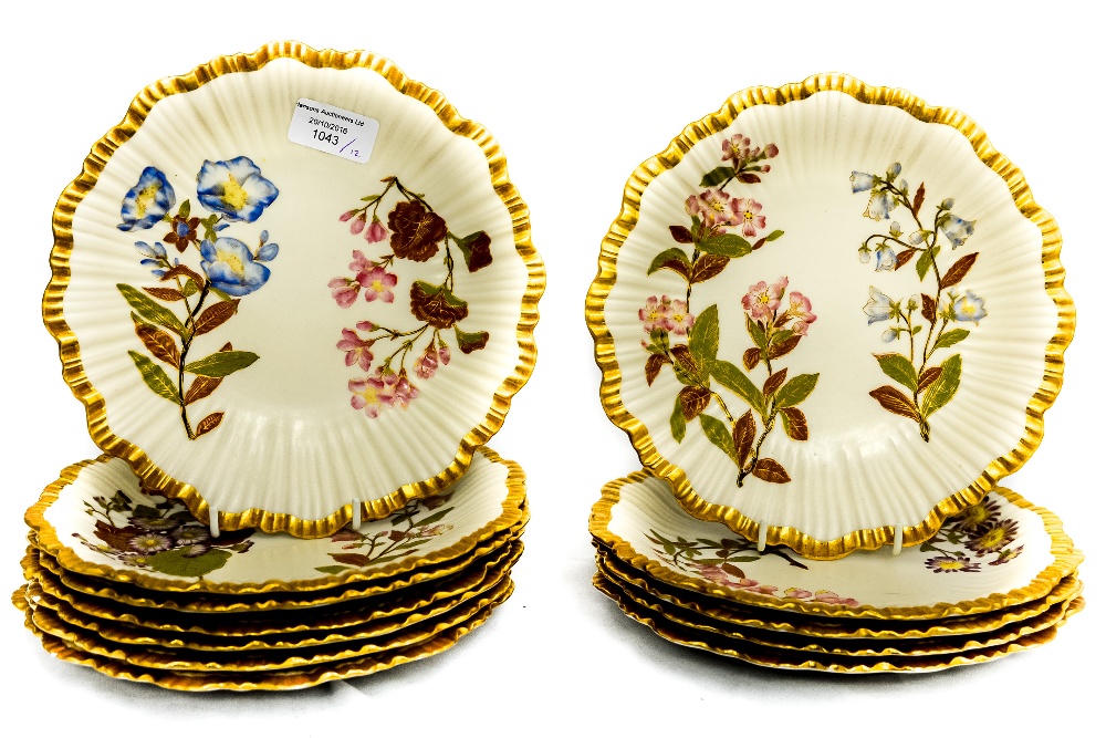 A set of twelve Royal Worcester ivory ground dessert plates, circa 1888,