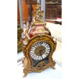 A French style mantel clock, stylised brass decoration, Roman numerals, glazed,