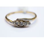 An 18ct gold ring set with five small diamonds, circa 1940s, 2.