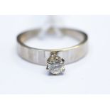A white metal ring set with diamond solitaire, claw set round brilliant cut diamond approx 0.
