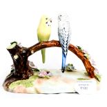 A Denton China group of two Budgies on a branch