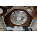 An Art Deco wood veneered mantle clock