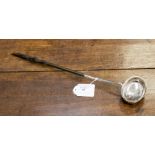 A George IV silver ladle, London 1824, makers mark for George Knight, having a horn handle,