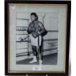 Boxing memorabilia: a framed and signed black and white photograph of Mohammed Ali in boxing gear