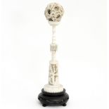 A 19th Century Chinese ivory puzzle ball on stand, the ball 6cm in diameter,