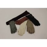 A new pair of calf suede elbow length gloves;