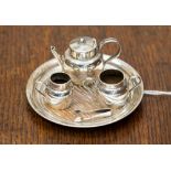 A miniature four piece Chester 1905 silver tea service with miniature tongs (5) 0.915 ozt/ 28.