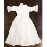 Cotton dolls dress with lace adornments and trims,