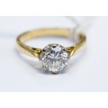 A diamond solitaire 18ct yellow gold ring, the round brilliant cut diamond weighing approximately 1.