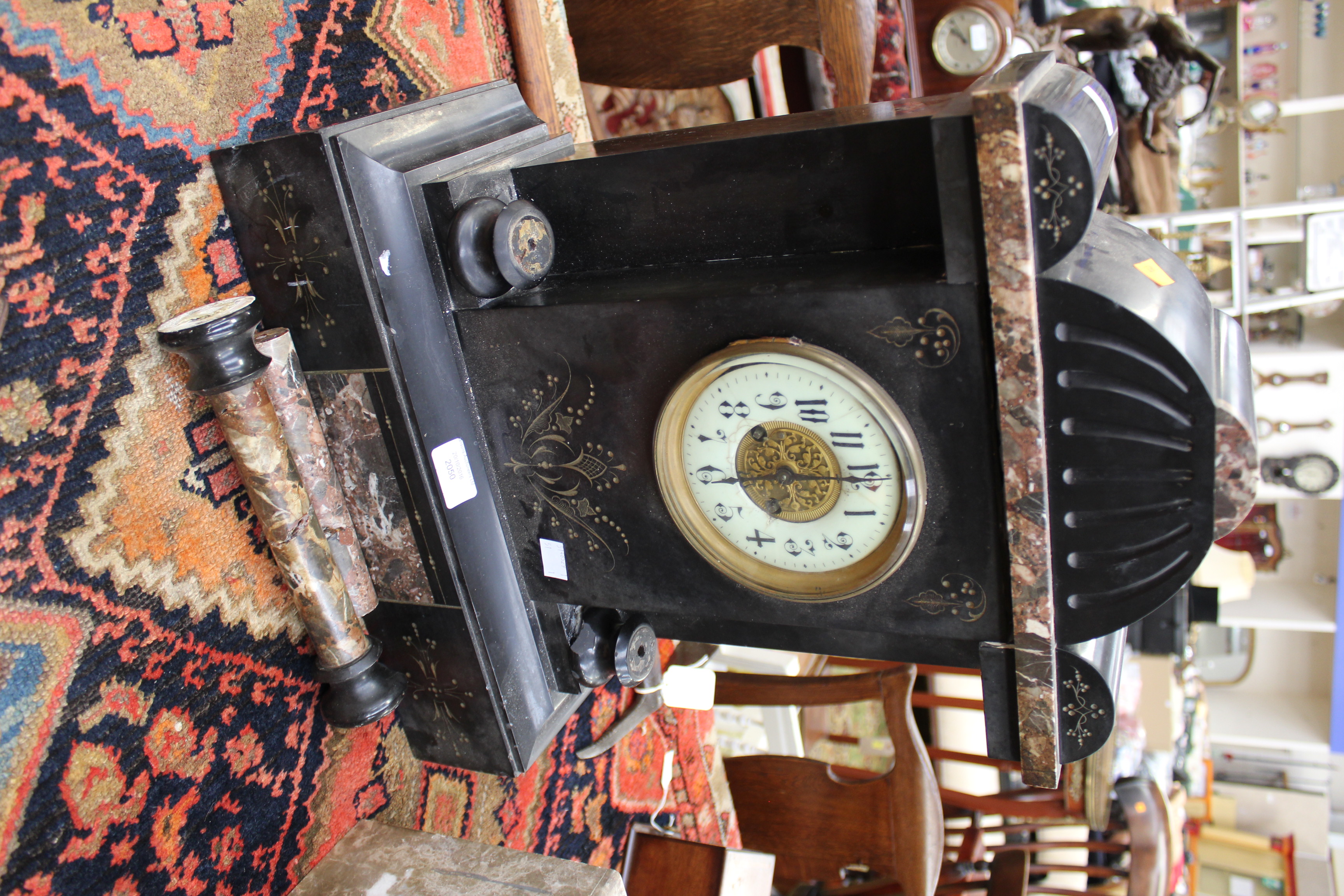 A 19th Century black slate mantle clock, with a circular white enamelled dial, Arabic numerals, - Bild 2 aus 2
