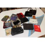 A collection of scarves and handbags,