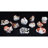 A collection of Royal Crown Derby Guild packs paperweights, including Derby Dormouse, Scruff Puppy,