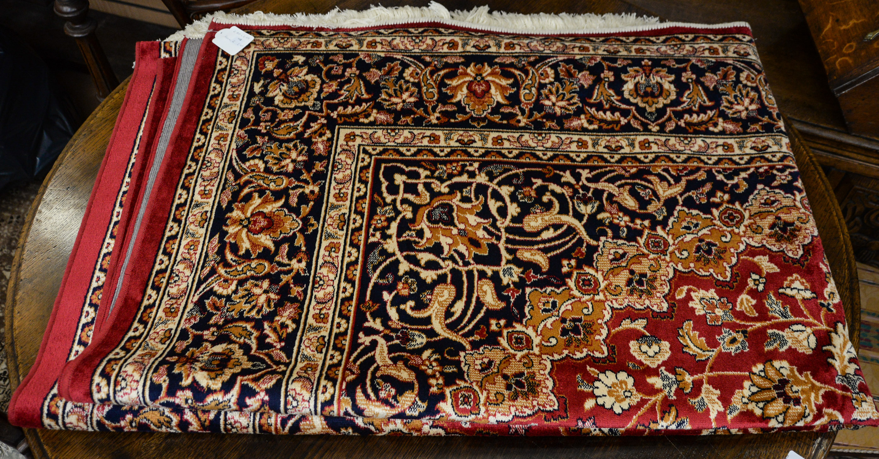 Red ground Keshan carpet, 280cm x 200cm.