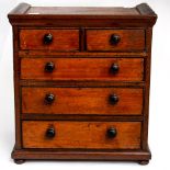 A miniature mahogany chest of two short over three long drawers