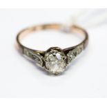 A diamond solitaire and 18ct gold ring, old cushion cut diamond approx 0.