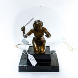 An Art Deco bronzed Spelter table lamp in the form of a nude girl, kneeling, holding aloft a stick,