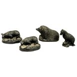 Four British hand carved coal figures, comprising two dogs,