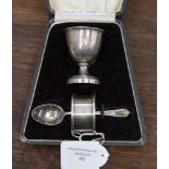 A George V silver Christening set, Birmingham 1925, comprising egg cup, spoon and napkin ring,