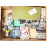 A box of assorted buttons, mother of pearl, coloured plastic, beads, etc.