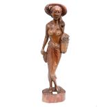A carved figure of a Balian lady,