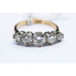 A five stone diamond and 18ct yellow gold and platinum ring,