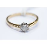 A diamond solitaire 9ct yellow gold ring, the diamond weighing approx 0.
