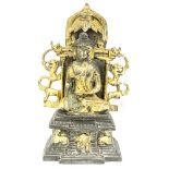 An Eastern gilt bronze figure of a seated Buddha,