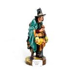 A Royal Doulton Figure 'The Mask Seller' HN 2103