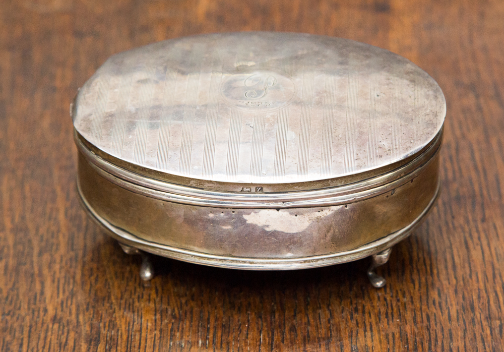 A Birmingham silver ladies raised oval jewel box with velvet lining S and Co 1924 with engine