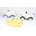Three novelty teapots in the form of 1920s racing cars,