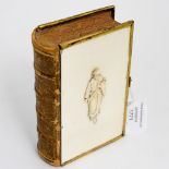 An 1864 Book of Common Prayer, with an Ivory front and back cover, and a Christ like,