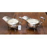 A pair of late Victorian silver sauce boats, scroll capped handle, hoof feet, Charles Stuart Harris,