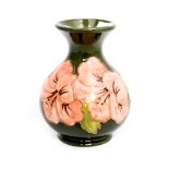 A green Moorcroft vase,