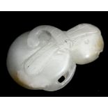 A Chinese carved jade pendant of a dragonfly on mushrooms,