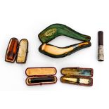 A Meerschaum pipe in case (Vienna) a Meerschaum and amber cheroot holder with white metal bands,
