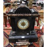 A 19th Century black slate mantle clock, with a circular white enamelled dial, Arabic numerals,