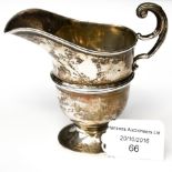 An early 20th Century silver pedestal milk jug, hallmarked for Birmingham 66 grams/2.