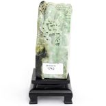 ***AMENDED GUIDE*** A 20th Century Soapstone carving in green tones on a wooden base
