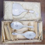 A boxed six piece silver brush set, Birmingham 1929, maker Henry Matthews,