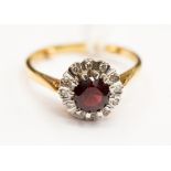 An 18ct gold garnet and diamond ring, size 'K½', 3.