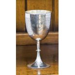 A Victorian silver goblet, bright cut engraved frieze with vacant oval cartouches,