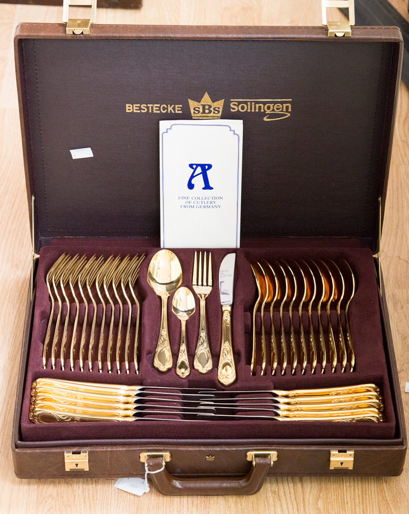 A cased Solingen canteen of 24ct gold plated cutlery