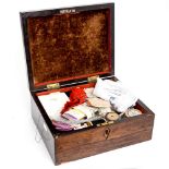 A late Victorian rosewood box containing sewing aids to include reels of cotton, needles, scissors,