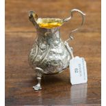 A George III silver cream jug, gilt lined, later decorated, Richard Mills 1761, approx 2.