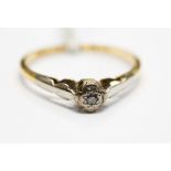 An 18ct gold diamond solitaire illusion set ring, size M, 1.