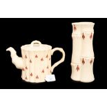 A Wedgwood cream Jasperware bamboo vase and a matching teapot,