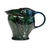 C H Brannam, an Art Pottery grotesque pelican jug, 1910, relief moulded,