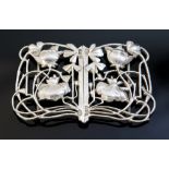 An Arts and Crafts silver buckle, in the Art Nouveau style with sinuous reticulated leaf design,