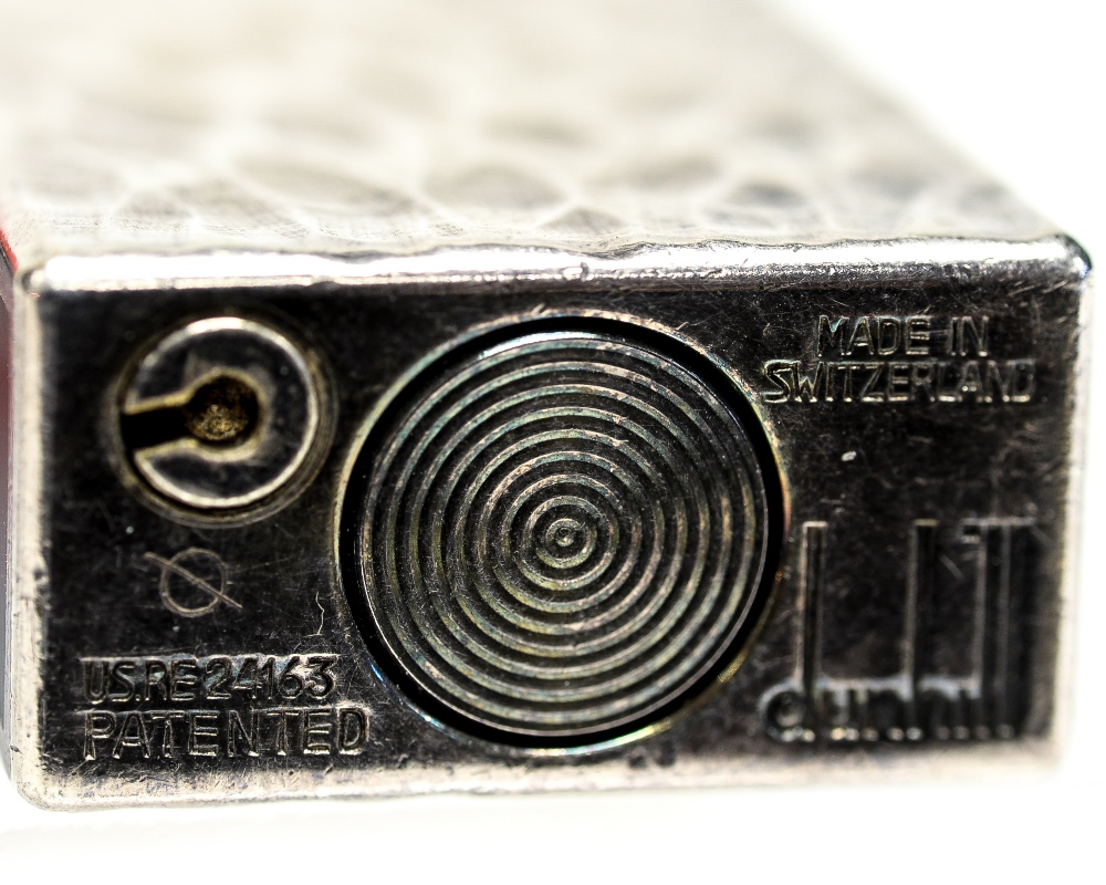 Alfred Dunhill, a silver plate and black enamelled lighter, bark effect with domed lid, - Image 2 of 2